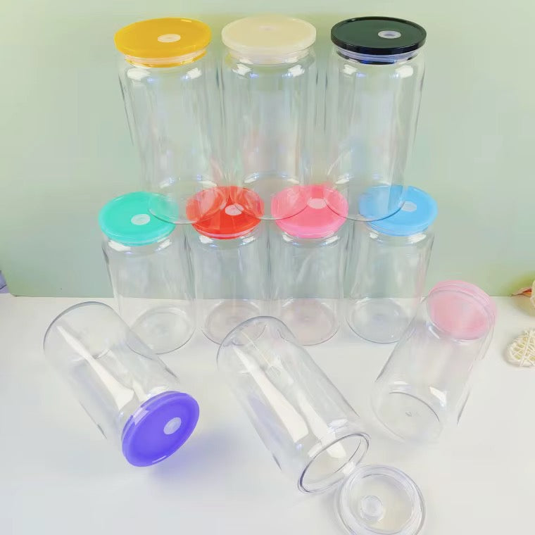 Clear 16 oz acrylic can-shaped tumblers with assorted coloured lids