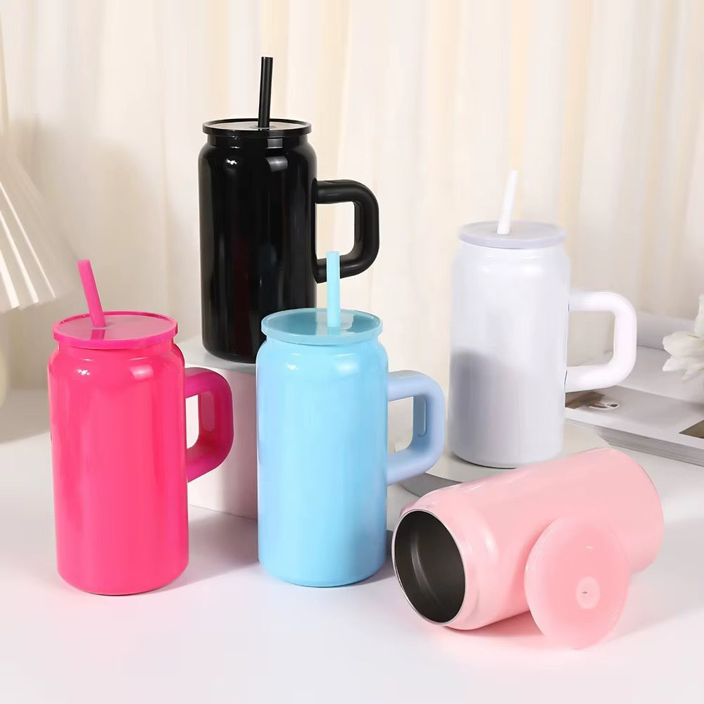 Black, white, hot pink, blue, and light pink can-shaped tumblers with handles and straws